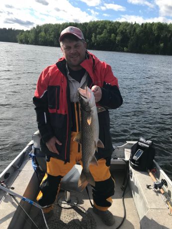 Man holding Lake Trout caught at Big Canon Lake Lodge