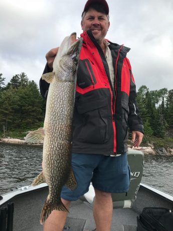 Man holding large Northern Pike
