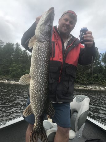 Man holding Northern Pike caught at Big Canon Lake Lodge